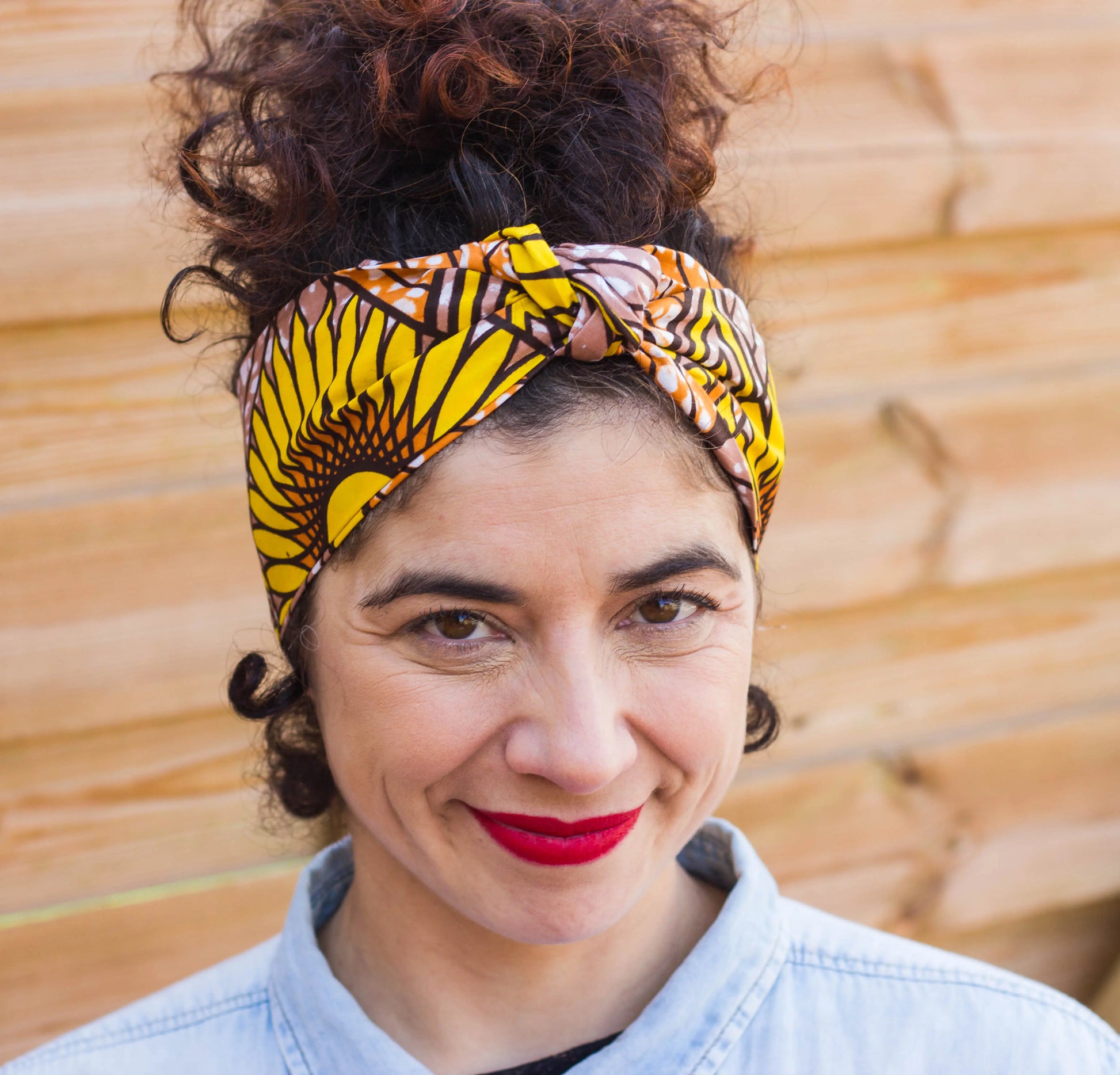 Diadema turbante estilo africano con flor de girasol amarilla - KHAMALI